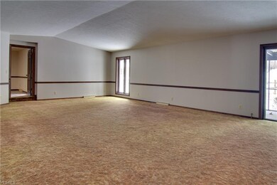 The living room with vaulted ceilings.