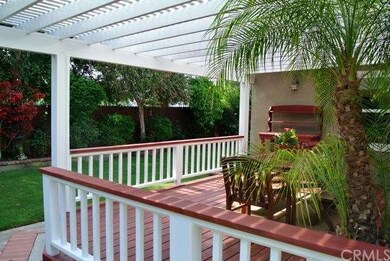 Redwood deck off family room from side yard.