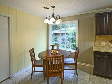 The breakfast area and kitchen are open to the fam