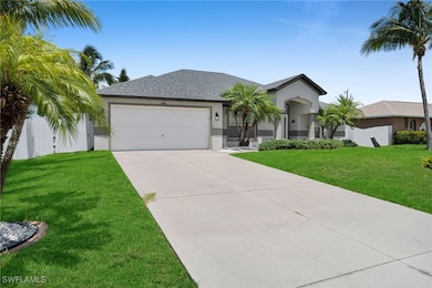 Ranch-style home featuring an attached garage, stu