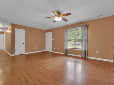 Spare room featuring ceiling fan and light hardwood / wood-style floors