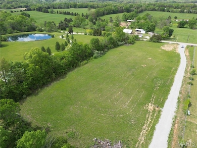 View of property location with a large body of water and rural landscape