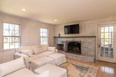Charming Den with wood burning brick fireplace