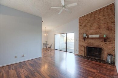 Open and airy living area with a brick accent wall