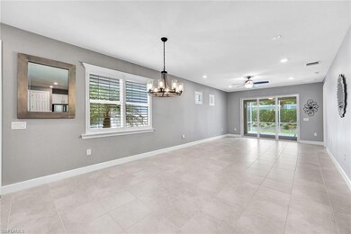 Tiled empty room with ceiling fan with notable cha