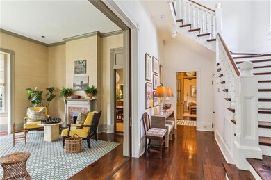 Gracious entrance hall and stairway.  Sliding door
