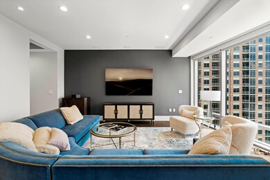 Living room featuring recessed lighting, wood fin