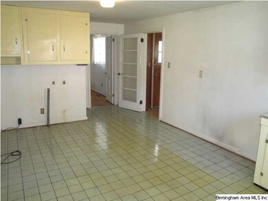 Huge eat-in kitchen space.  Door on right leads to