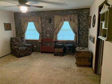 Sitting room featuring a textured ceiling, ceiling
