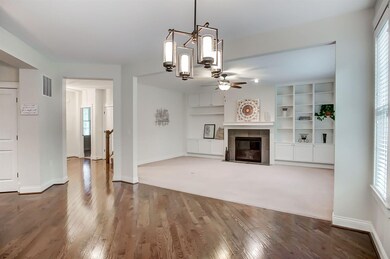 Foyer leads to Great room with built ins & fir