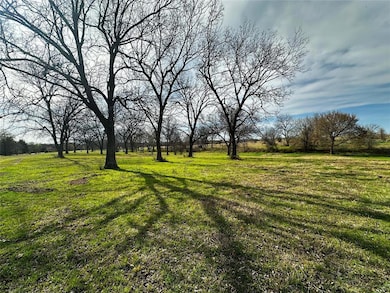 View of yard with a rural view