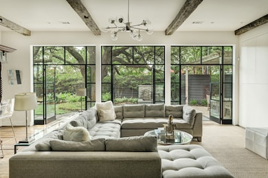 19th century hand-hewn beams and Portella windows and doors invite you into this exquisite great room. Complete with serene views of your backyard oasis.