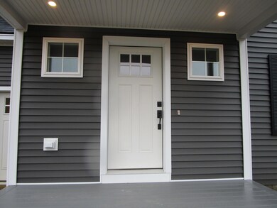 Entry door over with covered porch.