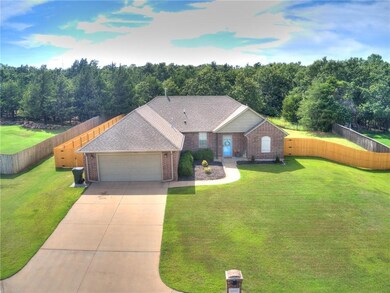 Front:  Your dream home awaits situated atop a hil