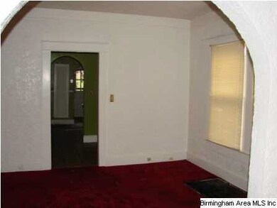 Arched entry from living room to dining room