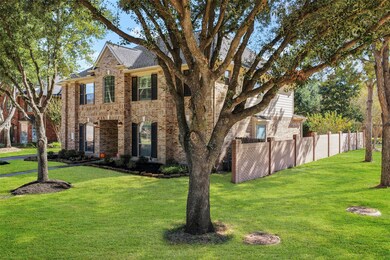 Nestled on a corner lot, this home has great curb appeal with its large shade trees and lush landscaping!