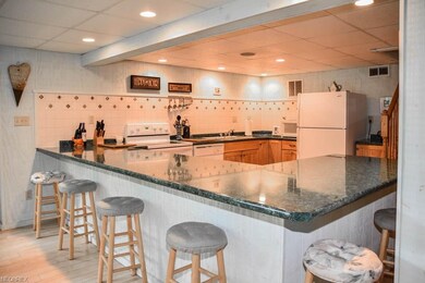 The kitchen is on the walkout lower level with a H