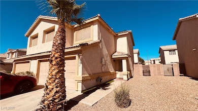 View of side of home featuring an attached garage,