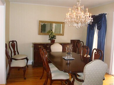 DR.  Gorgeous floors and chandelier. Furniture is 