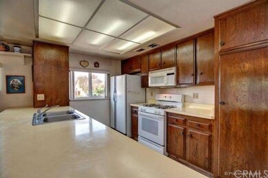The Kitchen Is Situated In The Center Of This Floor Plan It Flows Very Nicely With The Large Family Room, The Cabinets Have Been Recently Refinished, And The Large Counter Top Is Perfect For Displaying Food For Parties And Family Gatherings. 