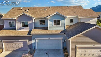 Back of home and garage view.