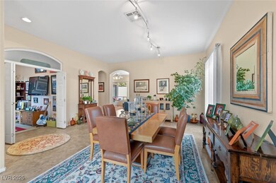 Dining space featuring rail lighting, plenty of na