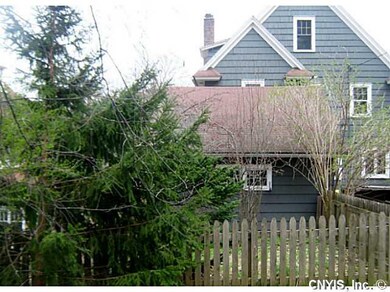 Backyard Small fenced in area on side of garage