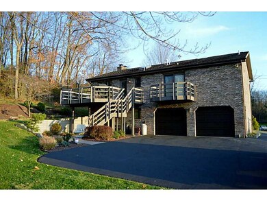 Exterior Back. Tons of parking, nice garage doors,