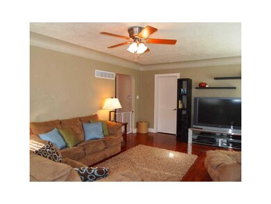 Family Room. Large windows, gleaming hardwood floo