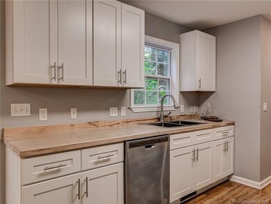 Brand new kitchen with elegant wood countertops.