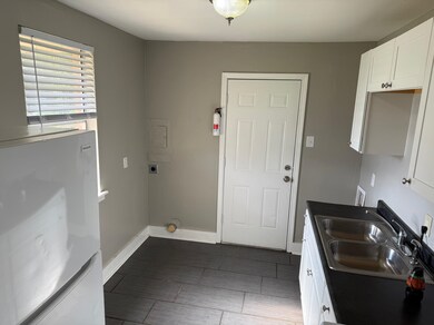Laundry room featuring hookup for an electric dryer and baseboards