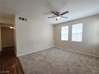 Unfurnished room with ceiling fan, baseboards, and