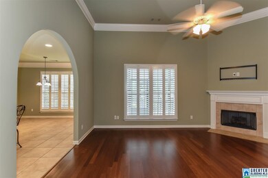 The inviting family room has high ceilings, hardwo