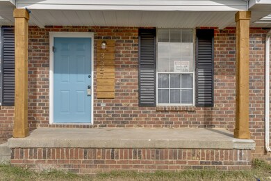 Covered front porch with new columns has plenty of room for a nice seating space