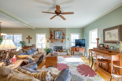 Step inside to a welcoming family room with fireplace and hardwood flooring.
