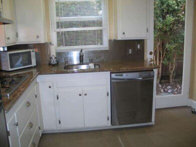 Up dated kitchen with granite counter tops and cer