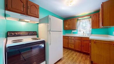 Includes electric range and refrigerator
