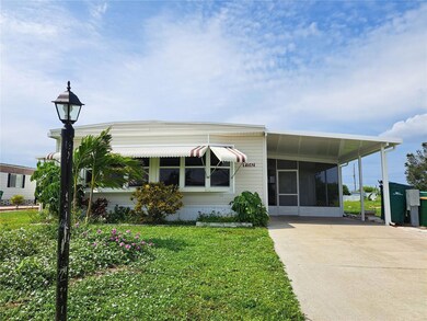 Front of house, with new carport.