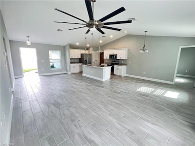 Kitchen with white cabinetry, stainless steel appl