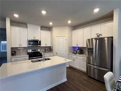 Kitchen with stainless steel appliances, a sink, a