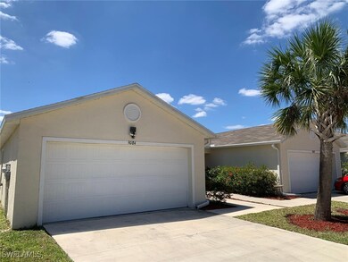 View of front of property featuring concrete drive