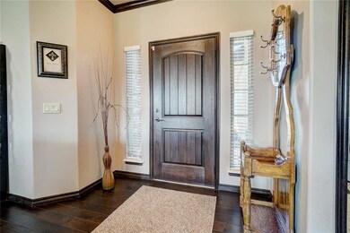 View of the front door.  Hardwood floors.