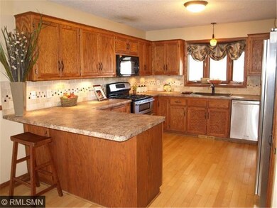 Kitchen with refinished maple hardwood floors also