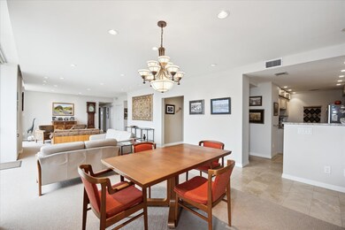 Dining space with recessed lighting, a chandelier