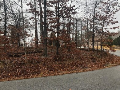 Standing with Back to the lot and looking straight.