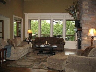Enter into the great room w/plank wood floors and 