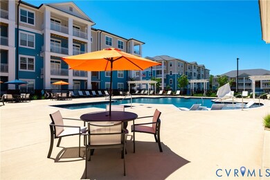 Community pool featuring a patio