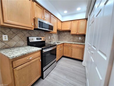 Refinished kitchen cabinets, new  granite counters, new tile backsplash, new sink, new faucet and new bifold doors (pantry).