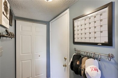 Entryway with closet.