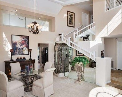 . . . formal living and dining, vaulted ceilings, 